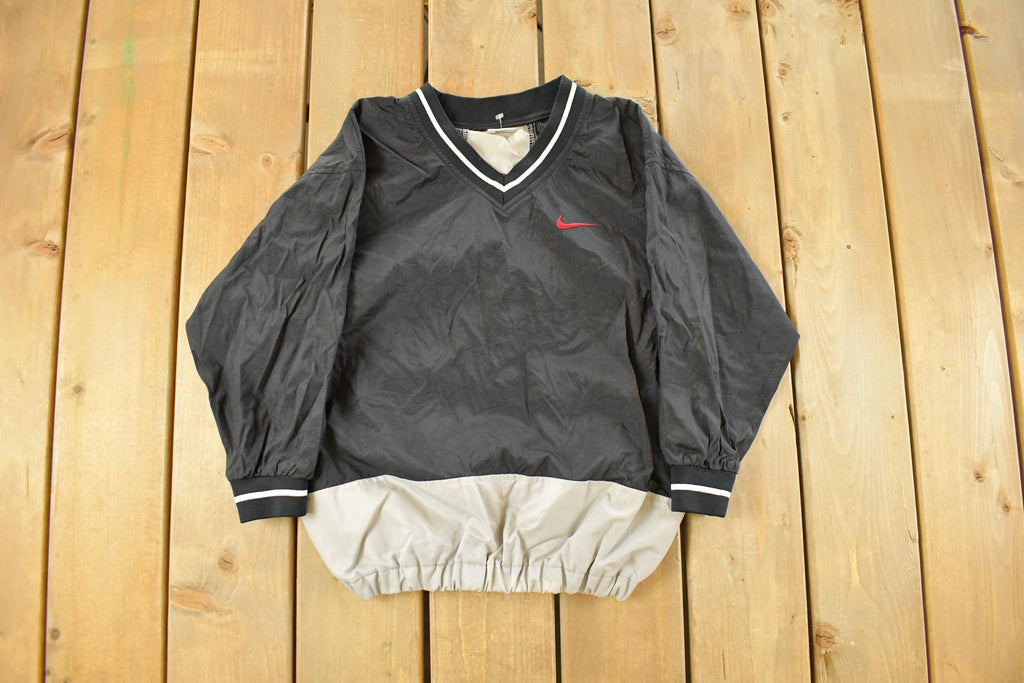 Vintage 1990s Nike Embroidered Mini Swoosh Pullover Windbreaker Youth Small
