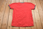 Vintage 1990s Nike Small Logo Graphic Ribbed Neck T Shirt