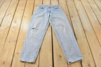 Vintage 1990s Levi's 560 Loose Tapered Denim Jeans Men's 26 x 31 / 90s Levi's / Distressed Sun Faded Jeans