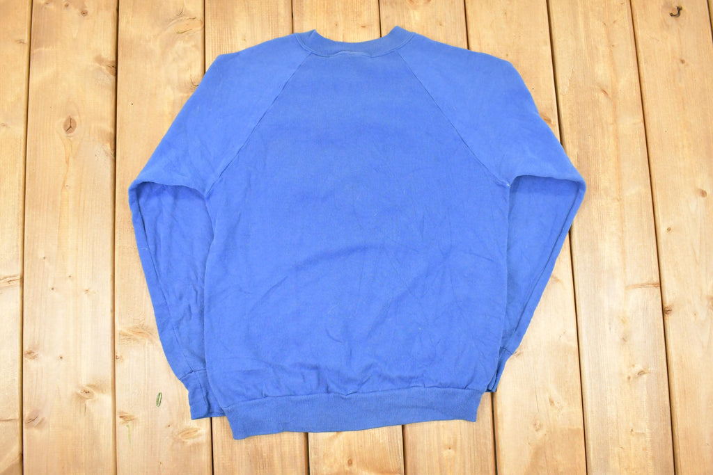 Vintage 1980s Jerzees Boundary Waters Speed Skating Cartoon Graphic Print Crewneck Sweatshirt Men's S