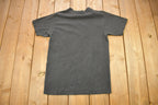Vintage 1990s Minnesota Vikings NFL Graphic Nutmeg T-Shirt