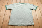 Vintage 1990s Embroidered Pro Line Green Bay Packers NFL Button Up Collar T-Shirt