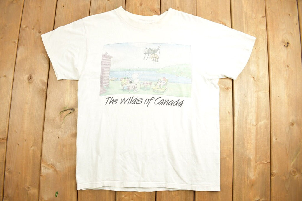 Vintage 1990s The Wilds Of Canada Funny Graphic T-Shirt  Streetwear  Retro Style  90s Graphic Tee  Funny Cartoon  Canada Travel