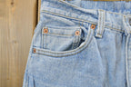 Vintage 1990s Levi's 550 Relaxed Tapered Denim Jeans Women's 28 x 31 / 90s Levi's / Distressed Sun Faded Jeans / Streetwear / Made in USA
