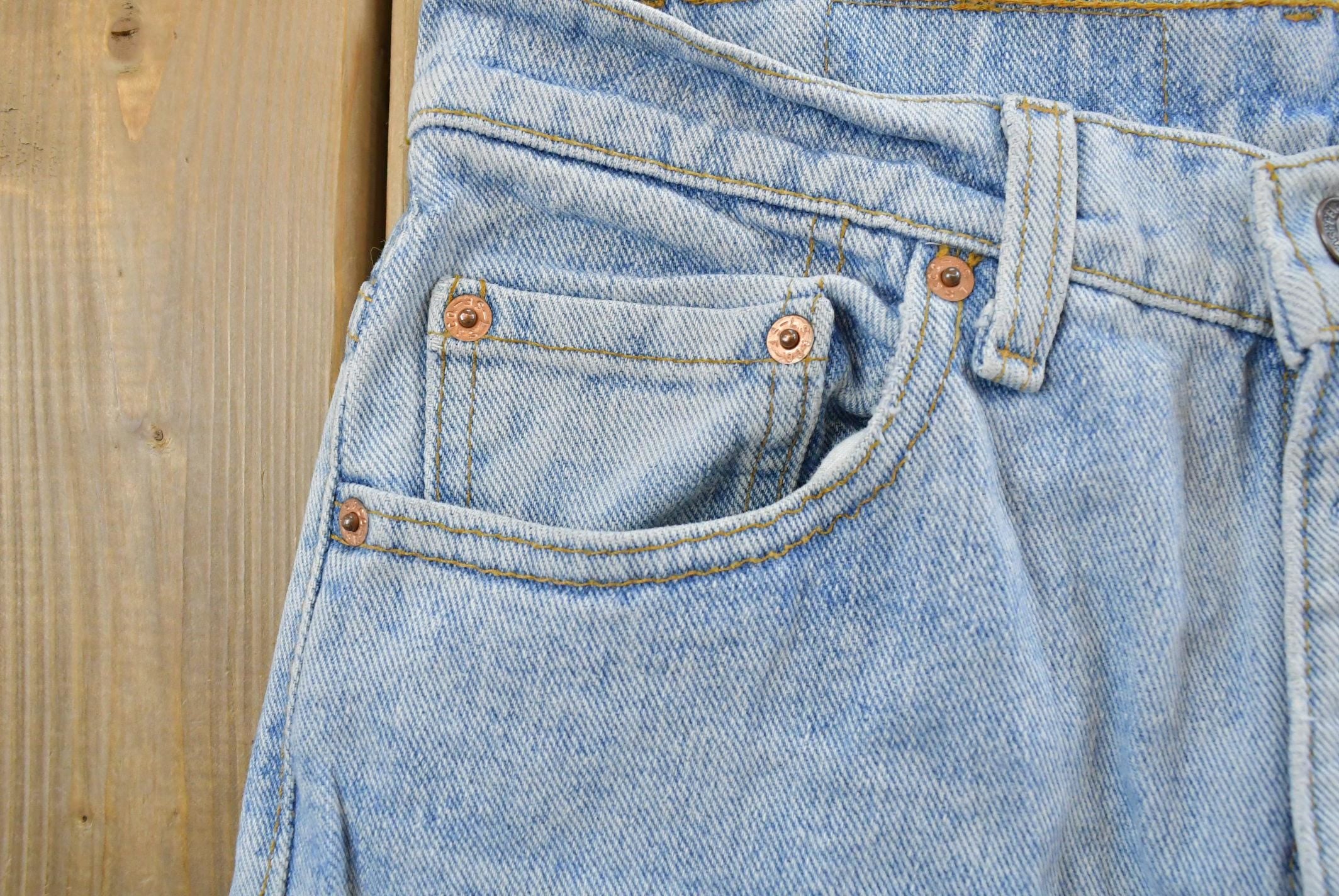 Vintage 1990s Levi's 550 Relaxed Tapered Denim Jeans Women's 28 x 31 / 90s Levi's / Distressed Sun Faded Jeans / Streetwear / Made in USA