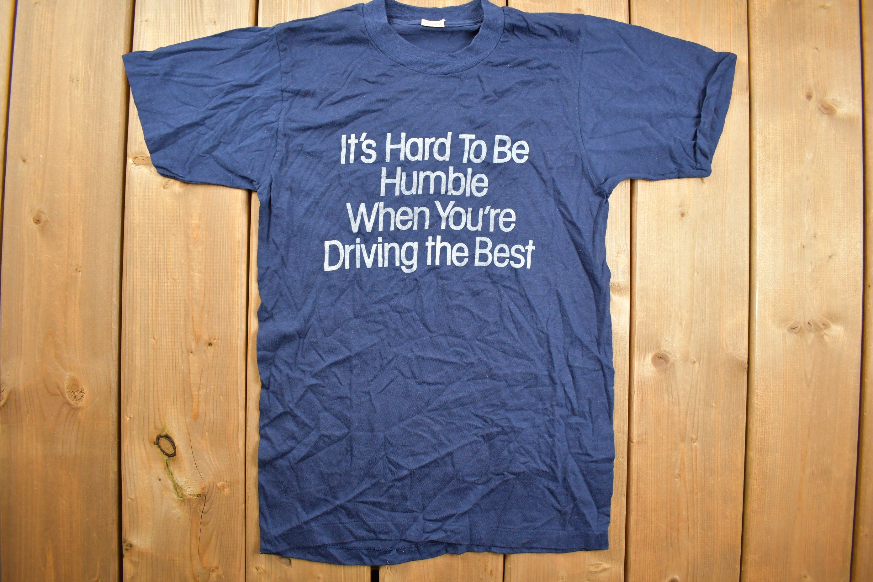 Vintage 1980s "Its Hard To Be Humble When You're Driving The Best" Graphic T Shirt