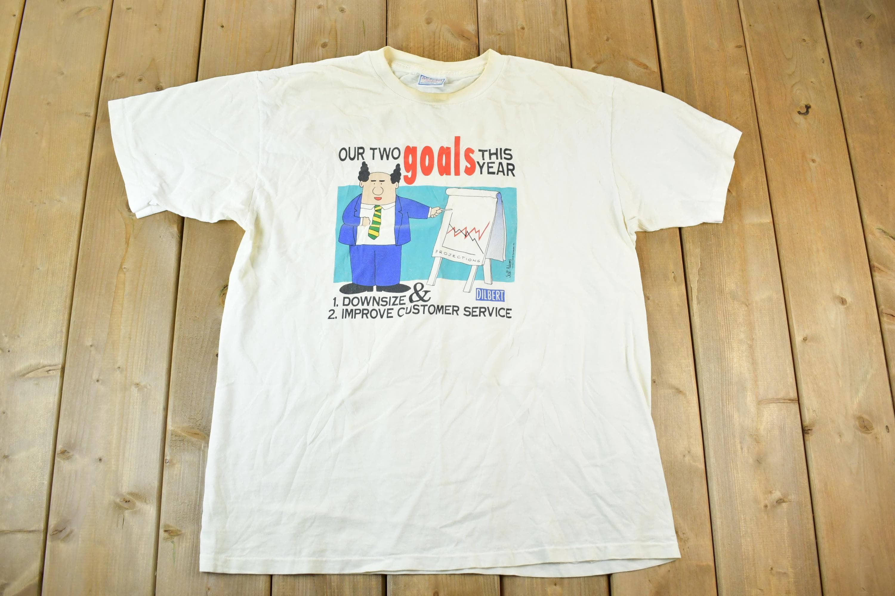 Vintage 1990s Dilbert Our Two Goals This Year Souvenir T-Shirt Mens L