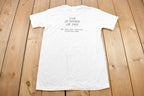 Vintage 1980s CPC Survivor Hugger Graphic T Shirt