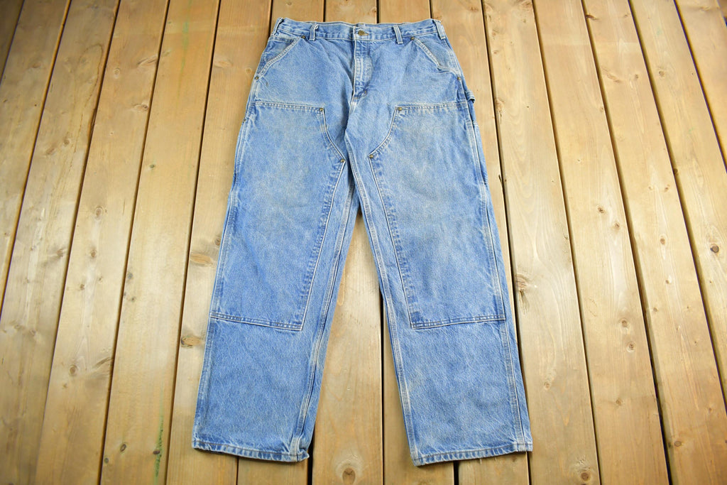 Vintage 1990s Carhartt Distressed Double Knee Denim Work Jeans Adult 34 x 30
