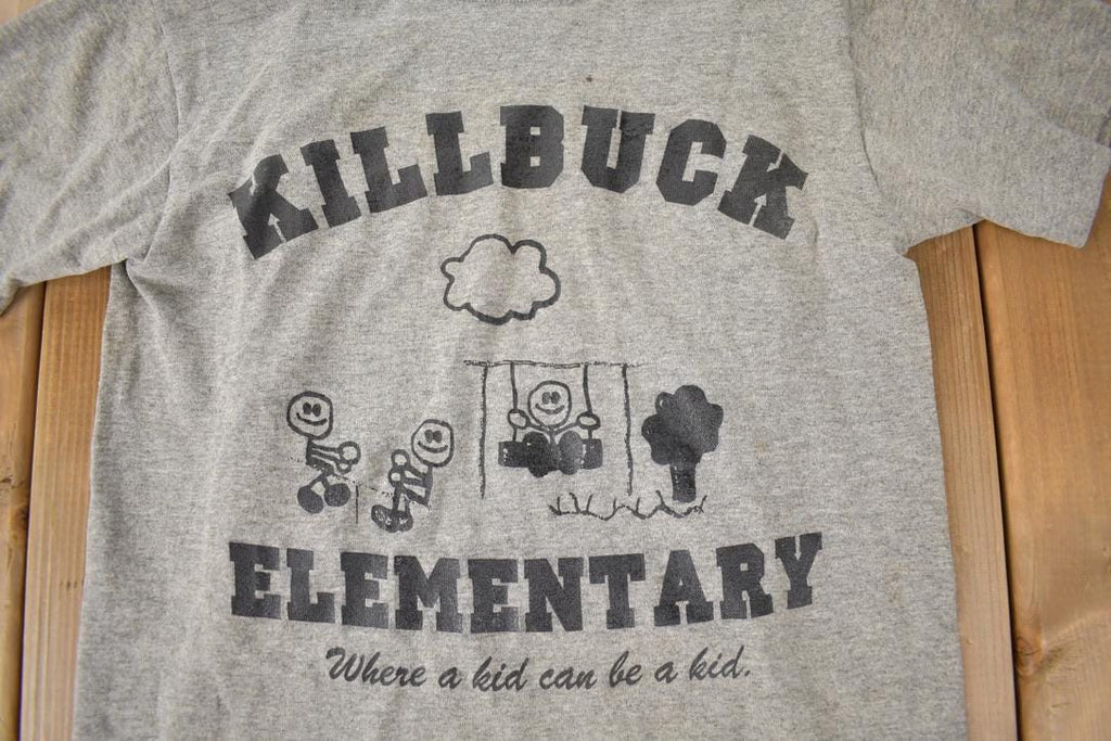 Vintage 1990s KillBuck Elementary Where A Kid Can Be A Kid Single Stitch Graphic Baby T Shirt Made In USA
