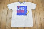 Vintage 1996 The Olympic Woman Atlanta Olympics Graphic T Shirt
