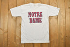 Vintage 1990s Notre Dame University Collegiate T-Shirt / NCAA Tee / Americana / Sportswear / Made In Canada / Athleisure / Sports