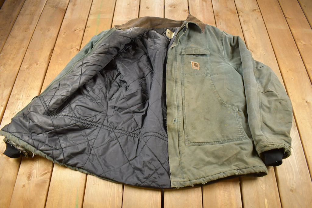 Vintage 1990s Faded Green Quilt Lined Thrashed Carhartt Traditional Jacket Workwear