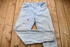 Vintage 1990s Perfectly Distressed Levi's 550 Light Wash Jeans