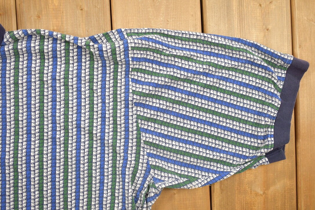 Vintage 1990s Munsingwear All Over Print Collared Polo Shirt