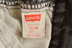 Vintage 1990s Youth Levi Black Tab Jeans Size 23 x 27