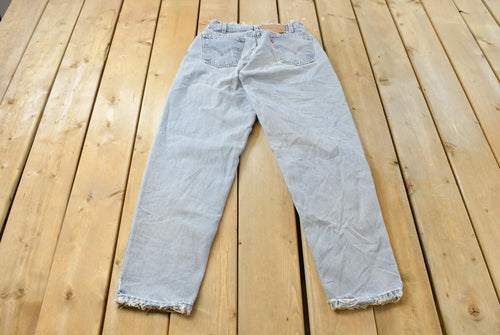 Vintage 1990s Levi's 560 Loose Tapered Denim Jeans Men's 26 x 31 / 90s Levi's / Distressed Sun Faded Jeans
