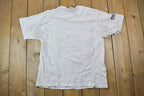 Vintage 1990s Oxfam Canada Gym Master Graphic T-Shirt