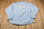 Vintage 1990s Tri-Mountain Nestle Embroidered Button Up Shirt