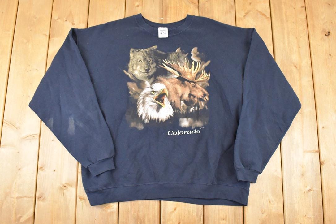 Vintage 1990s Colorado Hawk Wolf Moose Cartoon Graphic Print Crewneck Sweatshirt Mens L