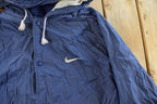 Vintage 1990s Nike Mini Swoosh Hooded Windbreaker Jacket Men's Large
