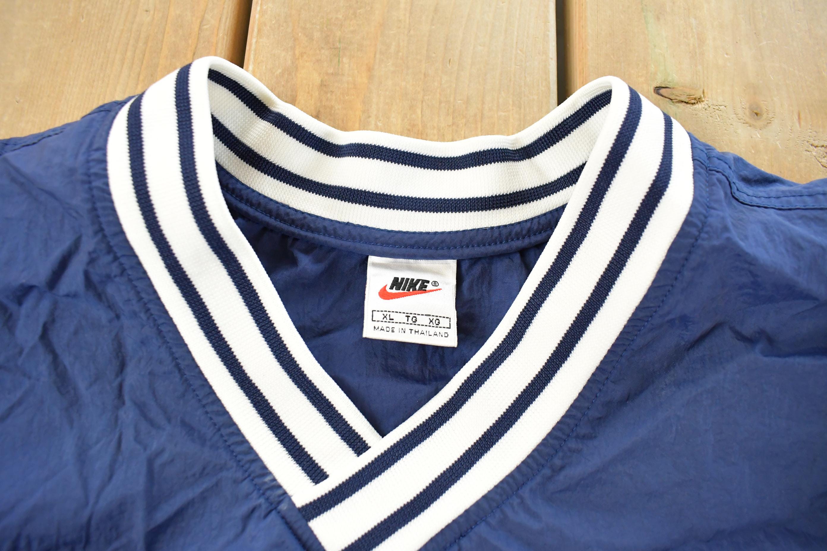 Vintage 1990s Nike Embroidered Mini Swoosh Pullover Windbreaker Men's XL