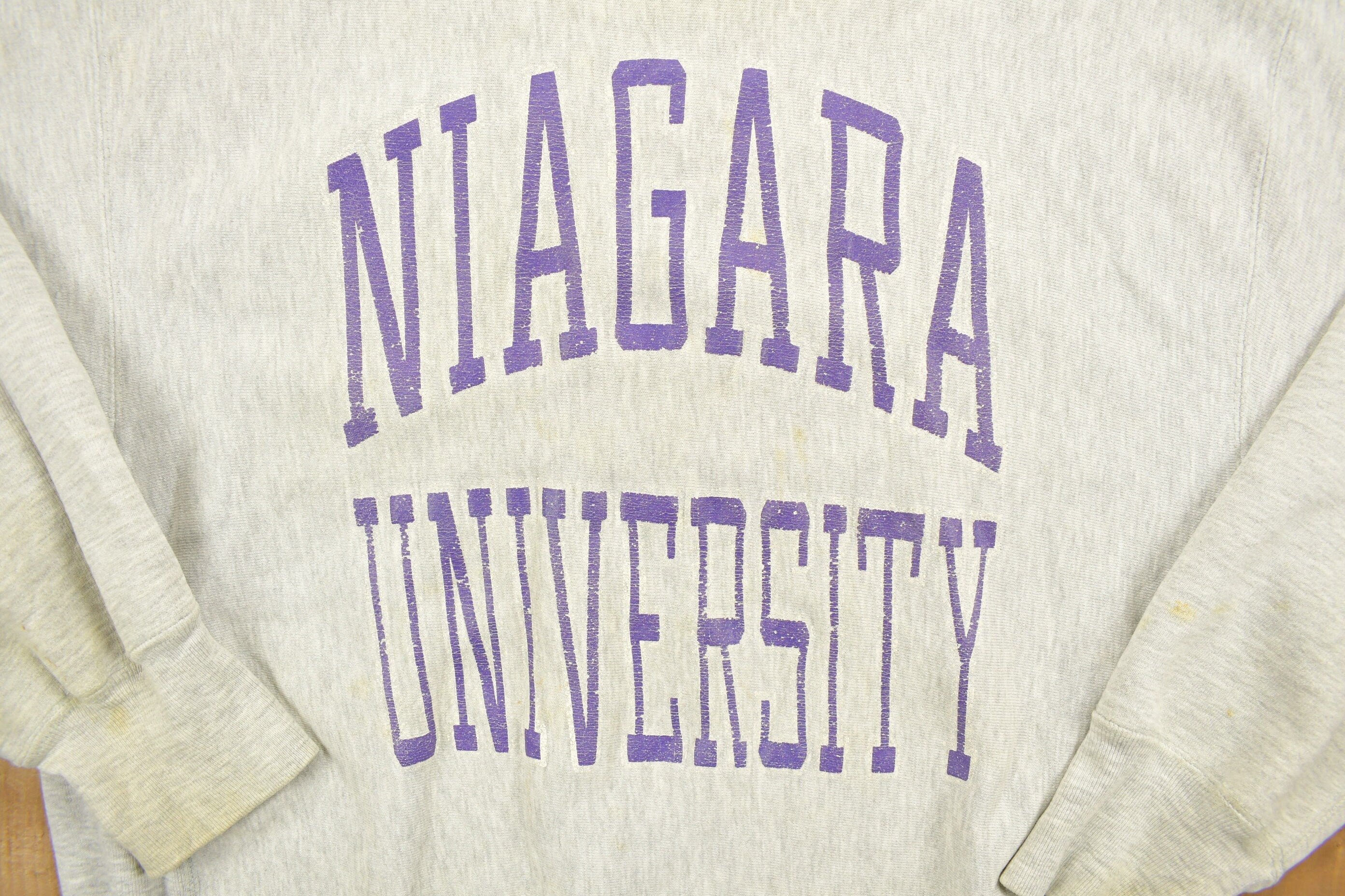 Vintage 1980's Champion Reverse Weave Warm-up Collegiate Crewneck University of Niagara Heavily Distressed.