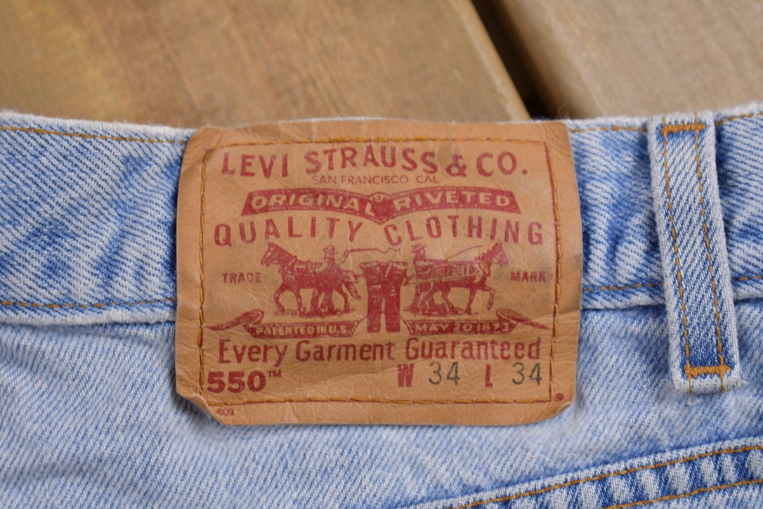 Vintage 1990s Levi's 550 Red Tab Denim Jeans Size 30 x 31