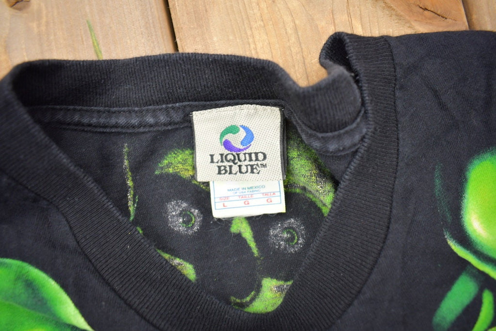 Vintage 2001 Liquid Blue Skull Pile All Over Print T-shirt