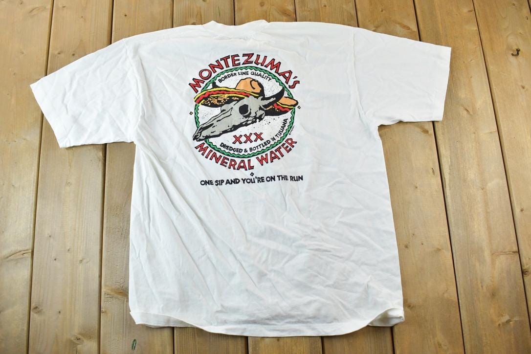 Vintage 1980s Crazy Shirts Montezumas Mineral Water Souvenir Single Stitch Graphic Print T-Shirt