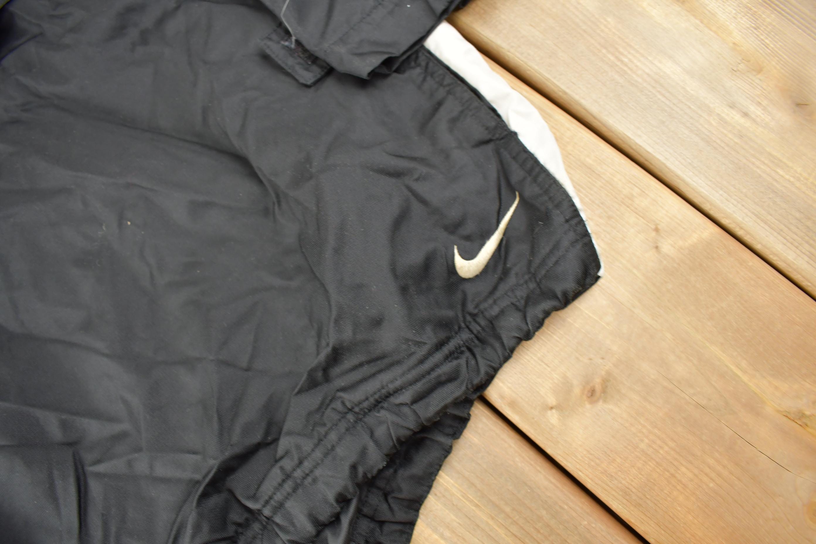 Vintage 1990s Black Nike Mini Swoosh Hooded Windbreaker Jacket Size XXL