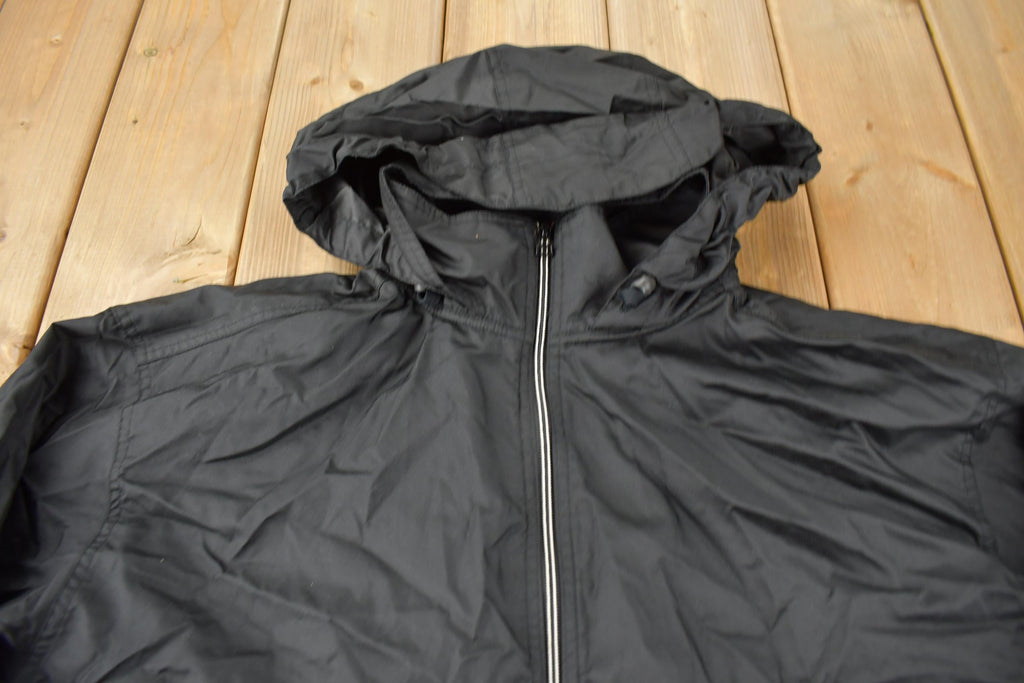 Vintage 1990s Black Nike Mini Swoosh Hooded Windbreaker Jacket Size XXL