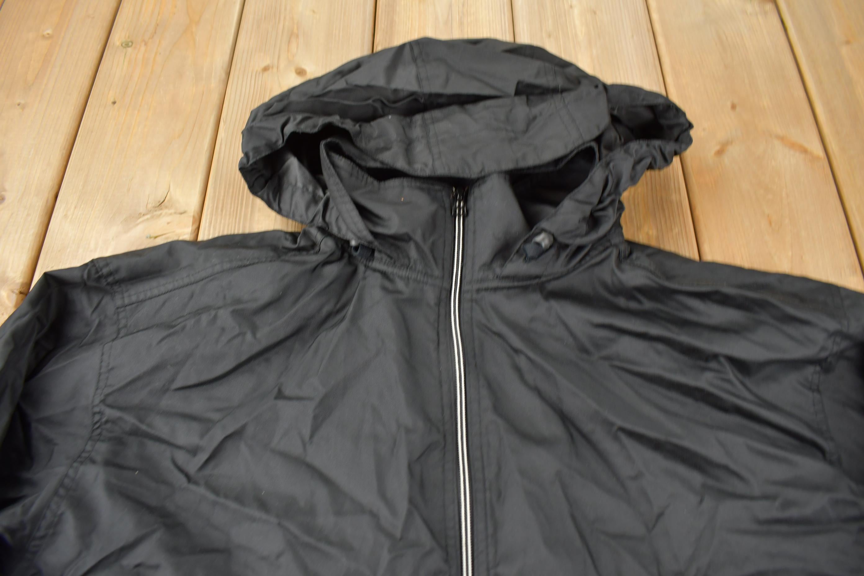 Vintage 1990s Black Nike Mini Swoosh Hooded Windbreaker Jacket Size XXL