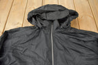 Vintage 1990s Black Nike Mini Swoosh Hooded Windbreaker Jacket Size XXL