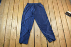 Vintage 1990s Nike Mini Swoosh Tearaway Click Button Track Pants