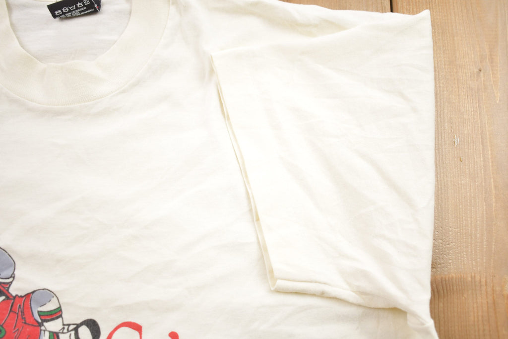 Vintage 1990s Screen Stars Best The Swiss Colony Graphic T-Shirt