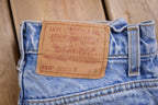 Vintage 1990s Levi's 550 Red Tab Jeans Size 26 x 23 / 90s Denim / Streetwear Fashion / Vintage Denim / Jeans / Light Wash / Vintage Levi's