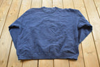 Vintage 1990s Notre Dame University Fighting Irish Thrashed Crewneck Sweatshirt Men's 2XL / NCAA College Spellout Sweater / Made in USA
