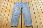 Vintage 1990s Levi's 560 Loose Fit Denim Blue Jeans Size 35 x 30 / 90s Levi's / Distressed Sun Faded Jeans / Streetwear