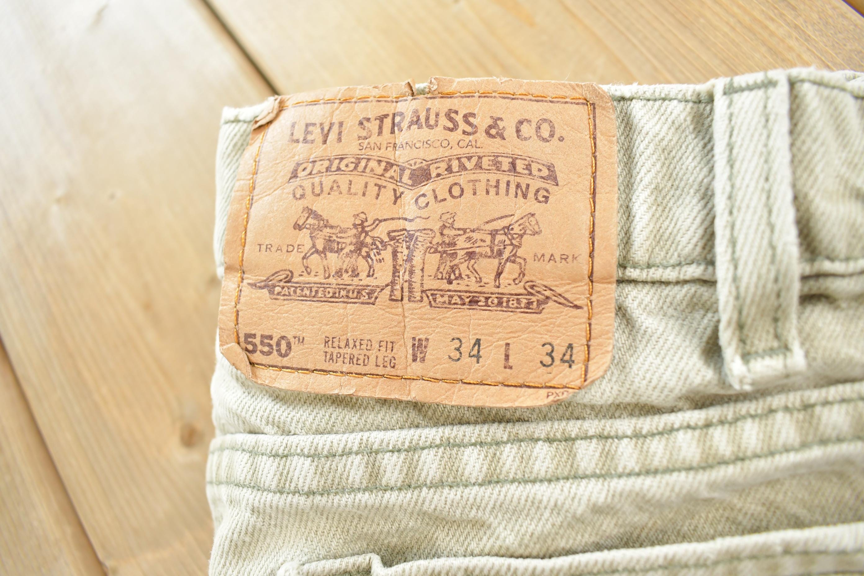 Vintage 1990s Levi's Orange Tab Distressed Denim Jeans Size 34x34