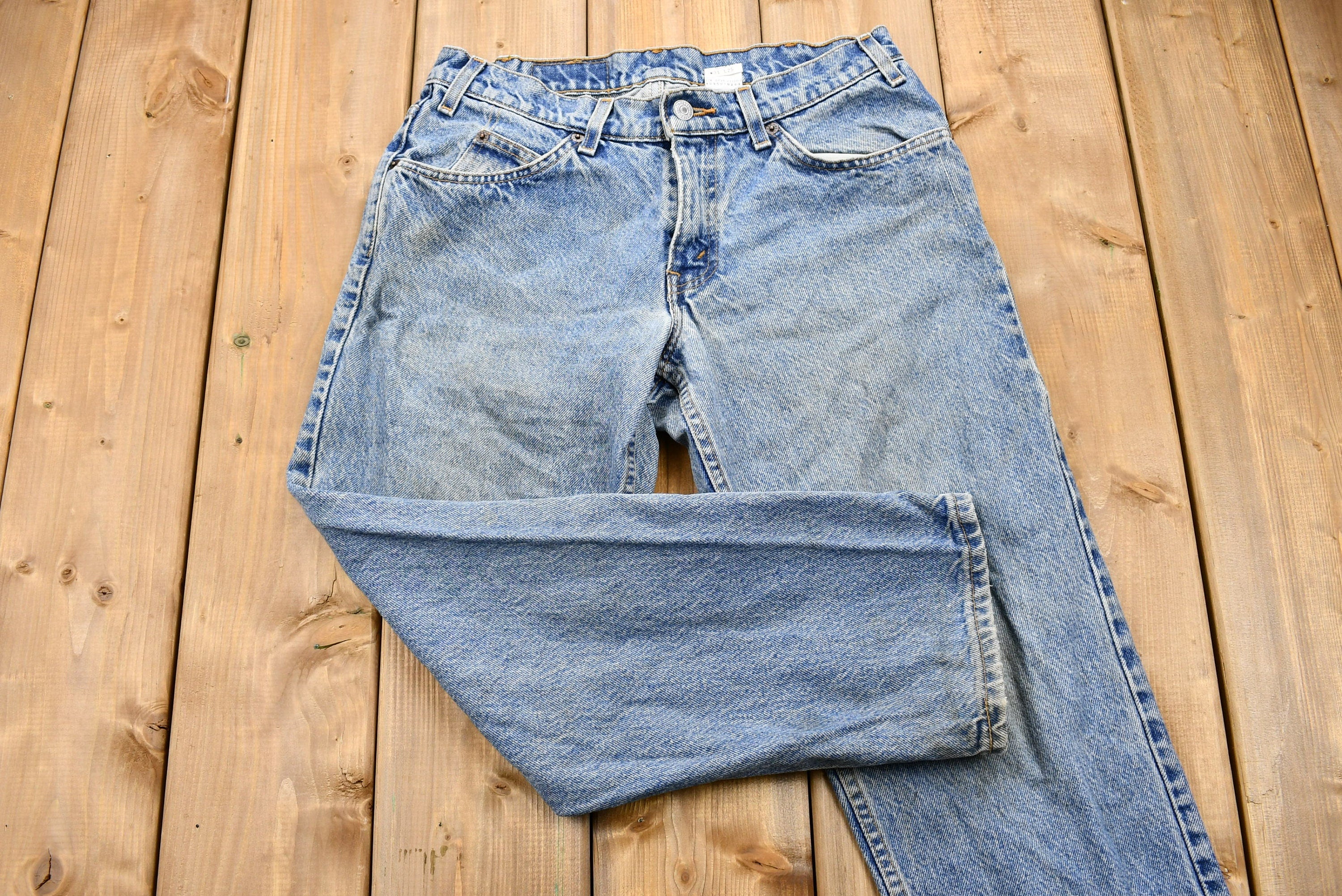 Vintage 1990s Distressed Levi's 550 Light Wash Jeans