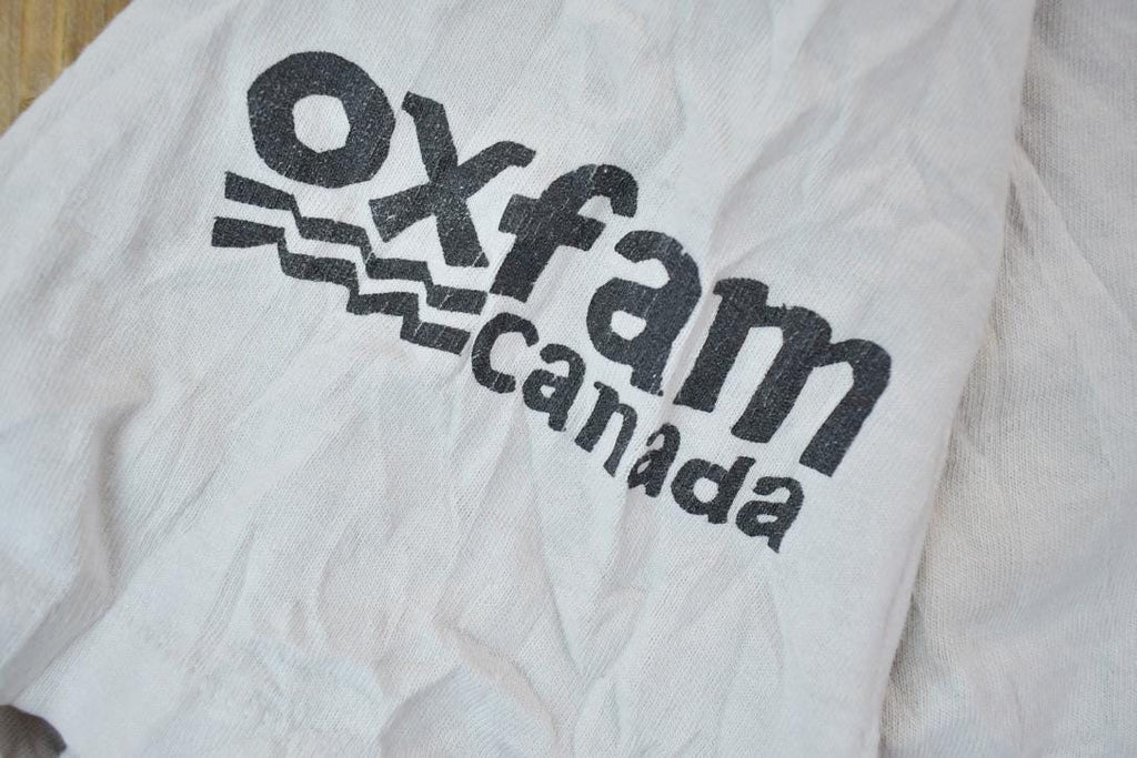 Vintage 1990s Oxfam Canada Gym Master Graphic T-Shirt