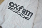 Vintage 1990s Oxfam Canada Gym Master Graphic T-Shirt