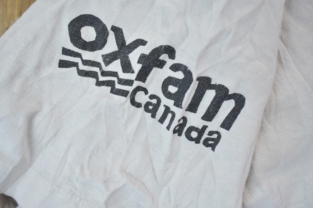 Vintage 1990s Oxfam Canada Gym Master Graphic T-Shirt / Vintage T Shirt / Streetwear / Graphic Tee / Single Stitch / Made In USA