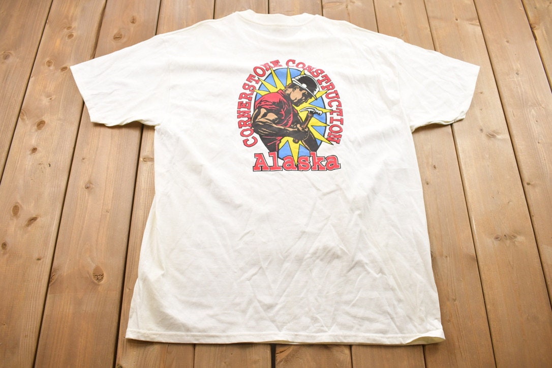 Vintage 1990s Hanes Power Building Cornerstone Construction Alaska Buff Worker Graphic T-Shirt