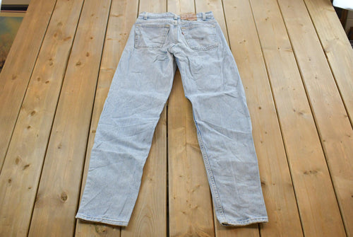 Vintage 1990s Levi's 550 Relaxed Tapered Denim Jeans Women's 28 x 31 / 90s Levi's / Distressed Sun Faded Jeans / Streetwear / Made in USA