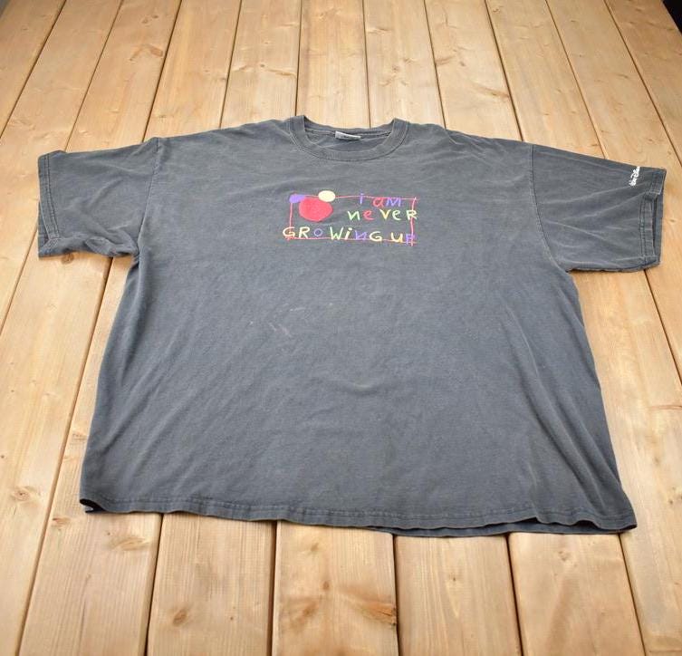 Vintage 1990s I Am Never Growing Up Disney World Graphic T-Shirt