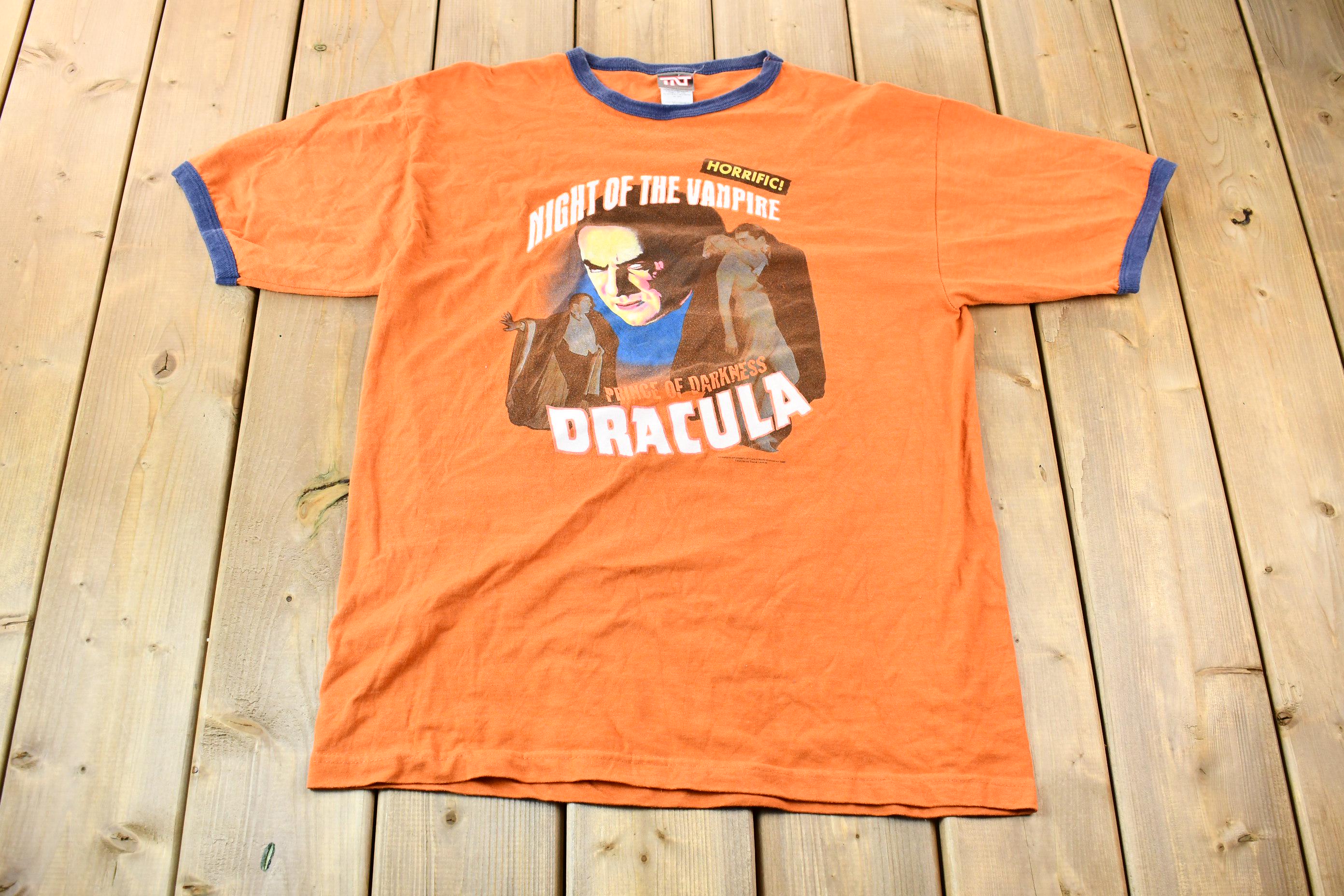 Vintage 2005 Dracula Night of the Vampire Orange and Blue Ringer Graphic T-Shirt