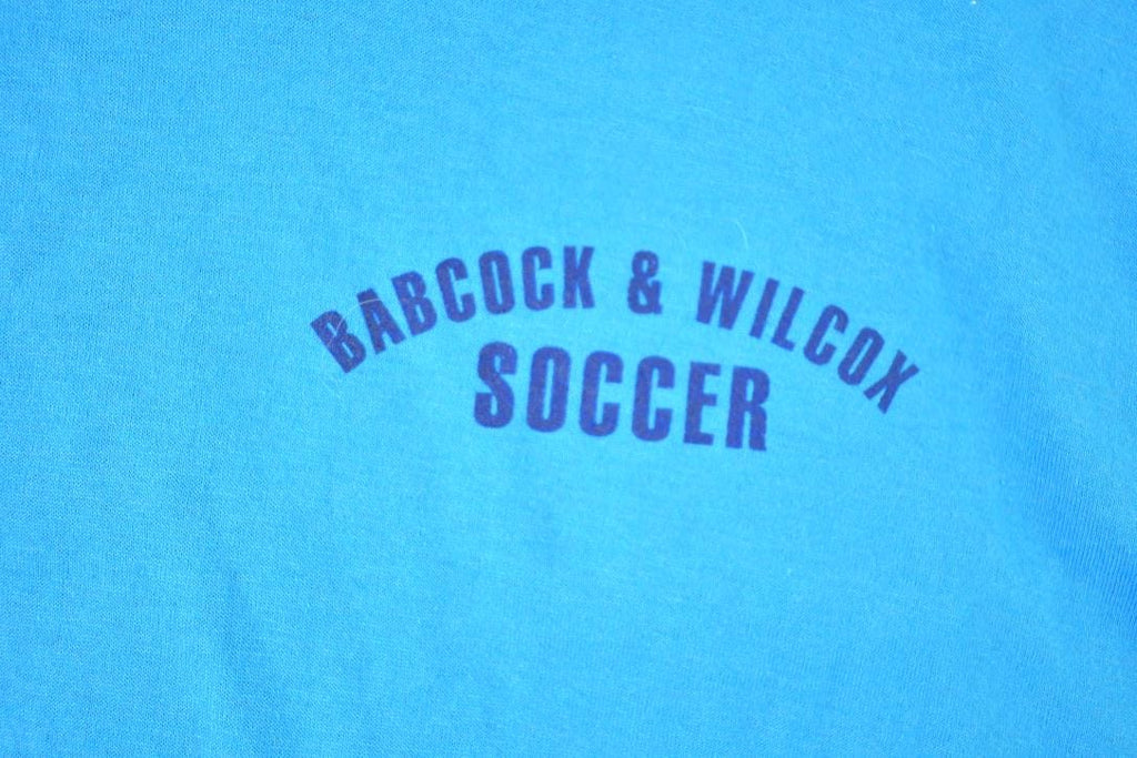 Vintage 1980s Deadstock Penmans Babcock and Wilcox Soccer Souvenir Single Stitch Graphic Print T-Shirt Made In USA