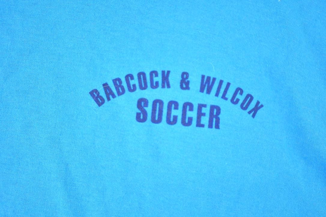 Vintage 1980s Deadstock Penmans Babcock and Wilcox Soccer Souvenir Single Stitch Graphic Print T-Shirt Made In USA